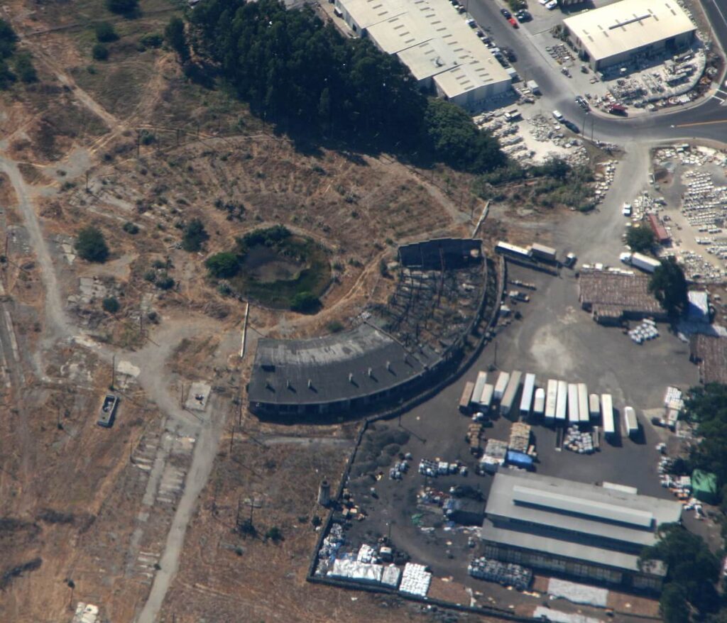 Aerial view of the Bayshore Roundhouse  in 2006 / Doc Searls / Wikimedia Commons
Link: https://commons.wikimedia.org/wiki/File:Bayshore_Roundhouse_%26_Tank_and_Boiler_Shop.JPG_(279022453)_(cropped).jpg#/media/File:Bayshore_Roundhouse_&_Tank_and_Boiler_Shop.JPG_(279022453)_(cropped).jpg