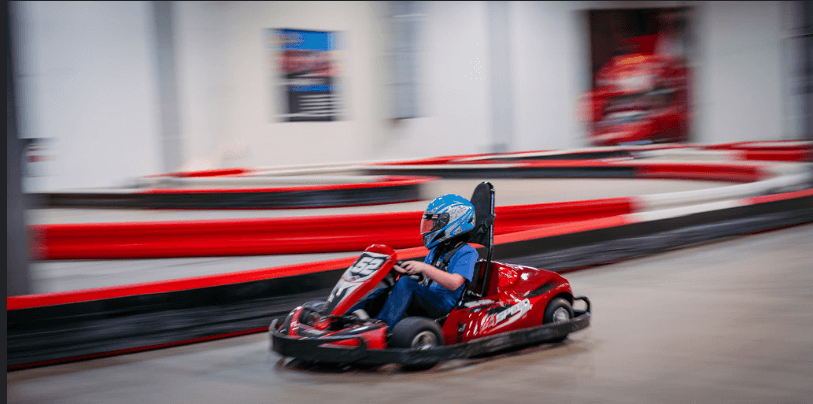 A kid go-karting on the track at K-1 Speed Indoor Go Karts / Flickr 
https://flic.kr/p/FHj1FU