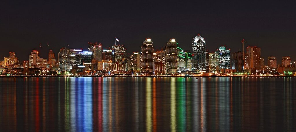 Skyline View of Downtown / Wikipedia / Rufustelestrat https://en.wikipedia.org/wiki/Downtown_San_Diego#/media/File:San_Diego_Reflecting_Pond.jpg
